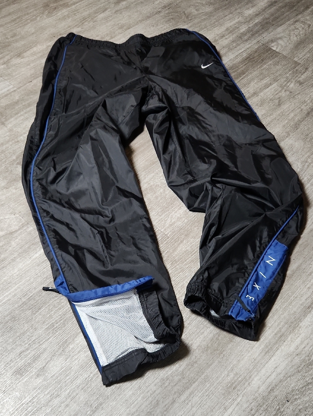 Vintage Nike Black Windbreaker Track Pants with Blue Trim Mesh Lining